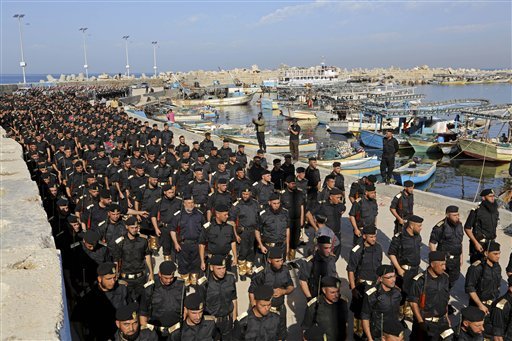 In this Dec. 4, 2014 file photo, members of the Palestinian Hamas security forces participate in their graduation ceremony at the fisherman's port in Gaza City, northern Gaza Strip. An Egyptian court declared Hamas a "terrorist organization" Saturday, Feb. 28, 2015, further isolating the rulers of the Gaza Strip who once found a warm welcome under the country's past Islamist government. The ruling described Hamas as targeting both civilians and security forces inside Egypt's restive Sinai Peninsula and aiming to harm the country. 