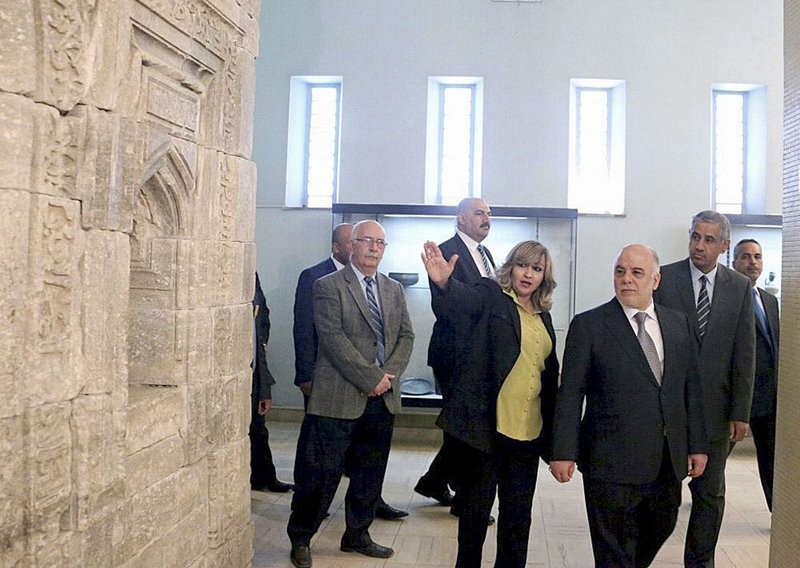 Iraq's Prime Minister Haider al-Abadi, third right, tours the Iraqi National Museum in Baghdad, Iraq, Saturday, Feb. 28, 2015. Al-Abadi vowed to track down and punish those who were behind the smashing of rare ancient artifacts in the northern city of Mosul. On Thursday, the Islamic State group released a video purportedly showing militants using sledgehammers to smash the statues, describing them as idols that must be removed. The act brought global condemnation. (AP Photo)