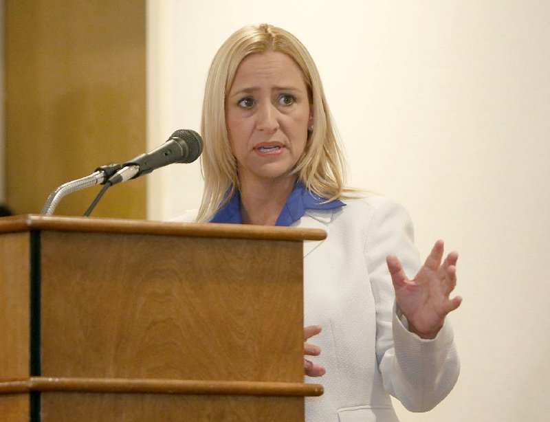 NWA Media/DAVID GOTTSCHALK - 7/17/14 - Leslie Rutledge, a republican candidate for the State of Arkansas Attorney General, speaks Thursday July 17, 2014 at the Northwest Arkansas Political Animals Club meeting in Fayetteville. Democratic candidate Nate Steel also spoke.
