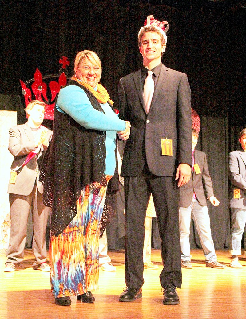 Submitted photo Mr. CMS: Cutter Morning Star Superintendent Nancy Anderson, left, congratulates senior Sam Byrd after he was named Mr. CMS on Jan. 30.