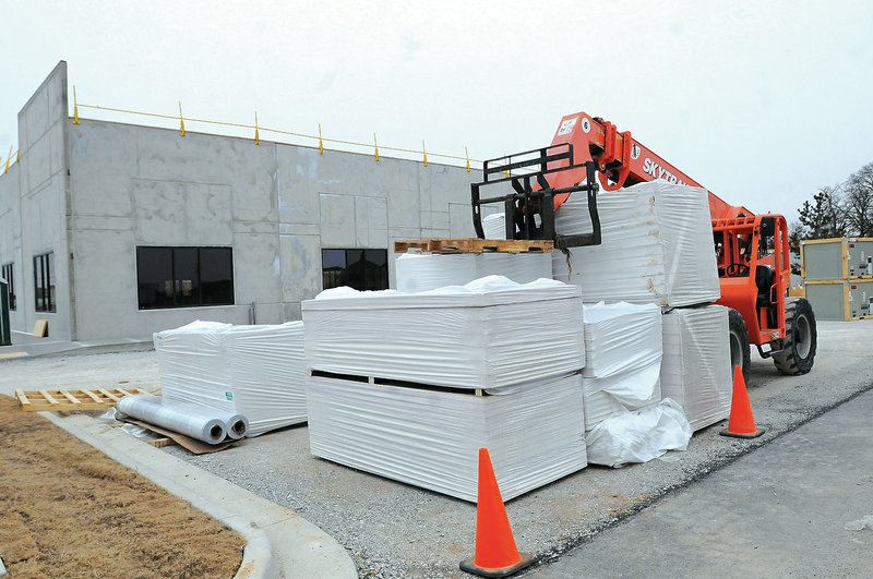 NWA Democrat-Gazette/FLIP PUTTHOFF The Haas Hall building is under construction Friday on Southeast J Street in Bentonville. In addition to the new building in Bentonville, the academy is planning to move into a new buillding in Fayetteville at 3880 N. Front St.