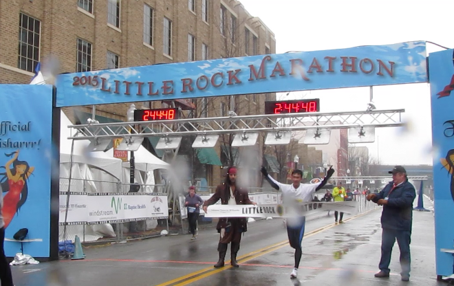 Yao Long, 25, of Changchun, China, crosses the Little Rock Marathon finish line with a winning time of 2:44:49.