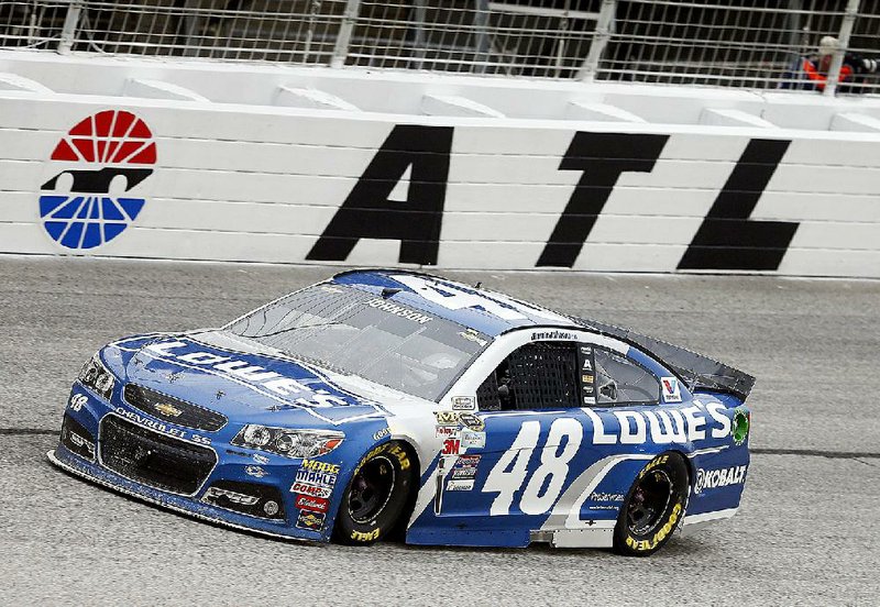 Sprint Cup Series driver Jimmie Johnson (48) is during the NASCAR Sprint Cup series auto race at Atlanta Motor Speedway Sunday, March 1, 2015, in Hampton, Ga.  (AP Photo/John Bazemore)