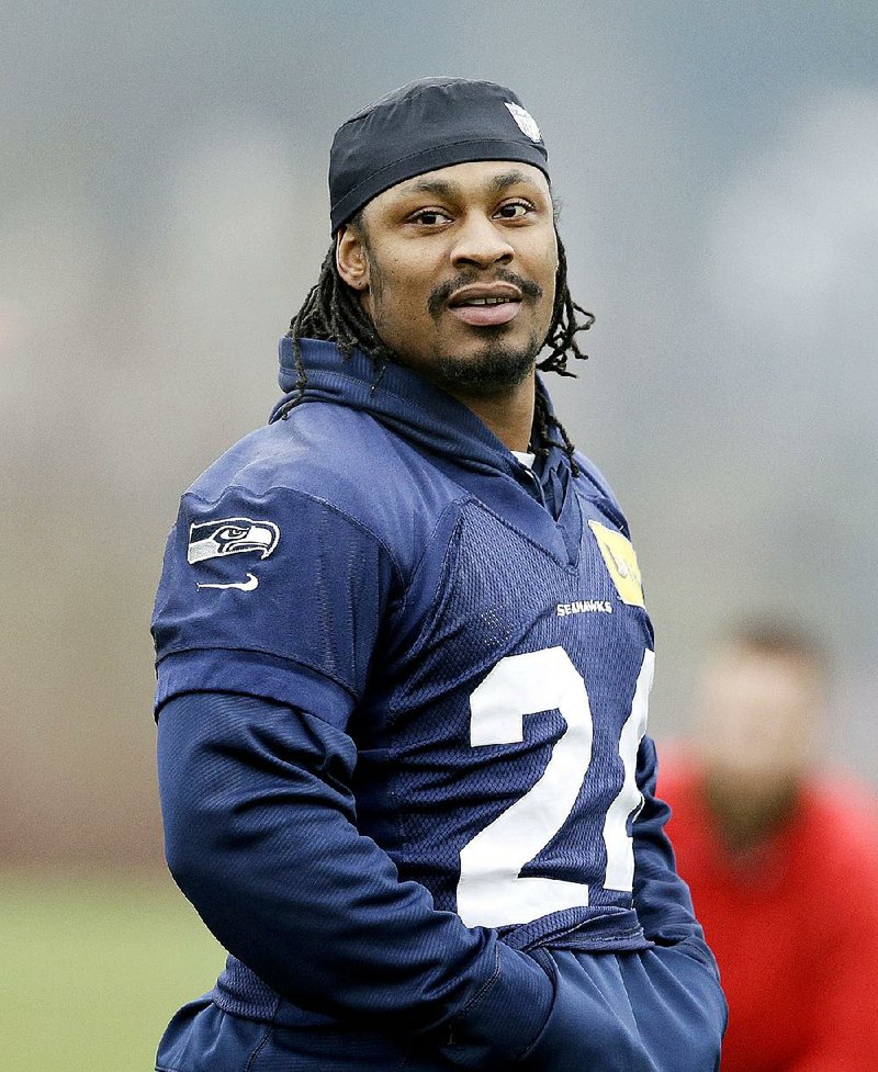 Seattle Seahawks' Marshawn Lynch walks on the field at an NFL football practice Thursday, Jan. 16, 2014, in Renton, Wash. The Seahawks play the San Francisco 49ers Sunday in the NFC championship game. (AP Photo/Elaine Thompson)