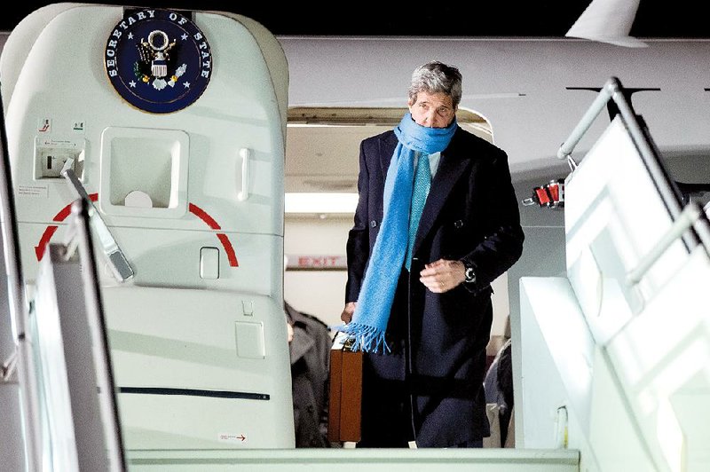 US Secretary of State John Kerry arrives at Geneva International airport, Sunday, March 1, 2015, in Geneva. Kerry is traveling in Switzerland for meetings with Iranian Foreign Minister Mohammad Javad Zarif about the ongoing nuclear talks.(AP Photo/Evan Vucci, Pool)