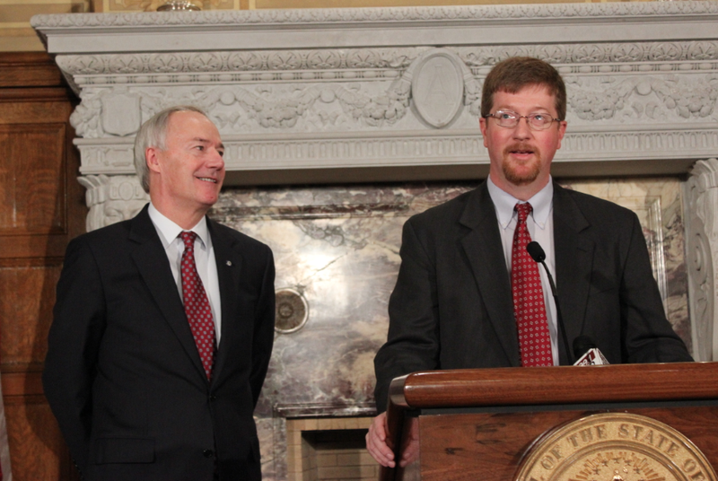 Johnny Key speaks while Gov. Asa Hutchinson looks on after being introduced Monday as Hutchinson's pick to be education commissioner. 