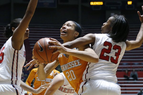 Tennessee center Isabelle Harrison (20) gets tied up by Mississippi guard Shandricka Sessom (23) during the first half of an NCAA college basketball game in Oxford, Miss., Thursday, Feb. 12, 2015. (AP Photo/Rogelio V. Solis)