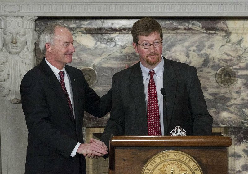 Former state Senator Johnny Key (right) has been named as Gov. Asa Hutchinson’s pick for the state’s new education commissioner. Hutchinson (left) announced Key would be his choice Monday afternoon at the state Capitol. 