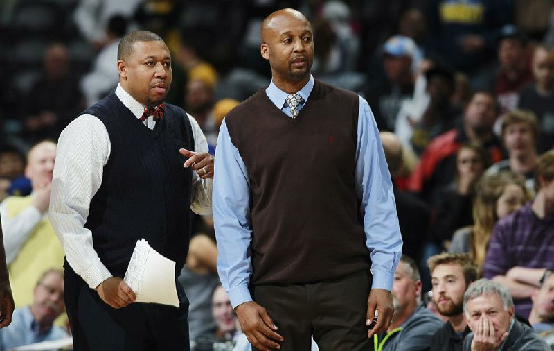 In this April 16, 2014, file photo, Denver Nuggets assistant coach Melvin Hunt, left, joins head coach Brian Shaw in contesting a call while facing the Golden State Warriors in the fourth quarter of the Warriors' 116-112 victory in an NBA basketball game in Denver. The Nuggets have fired coach Brian Shaw after 1½ seasons. Assistant coach Melvin Hunt will serve as interim coach. 