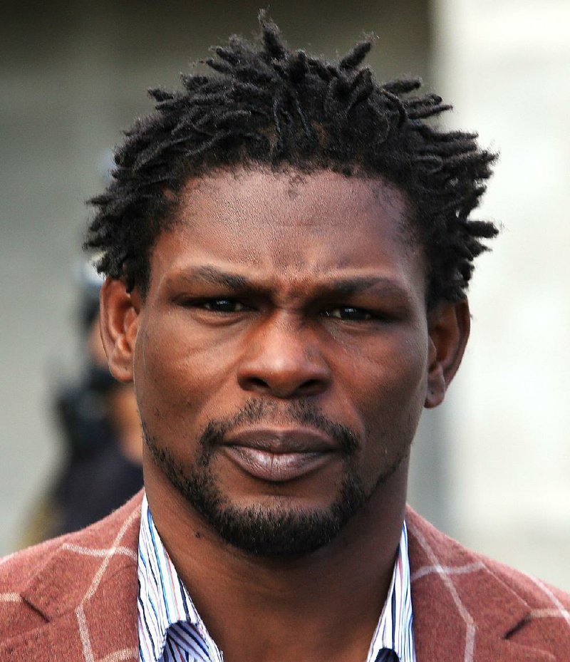 In this file photo Jermain Taylor, former middle weight boxing world champion, leaves the Pulaski County Jail in Little Rock after posting a $50,000 bond following his arrest for pulling a gun and opening fire on Thelton and Toya Smith and their three kids after a Martin Luther King Jr. Day parade in Little Rock.