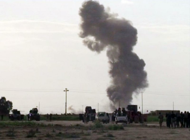 Smoke rises from an explosion as Iraqi forces, Shiite militiamen and Sunni tribal fighters battle Islamic State militants for control of Tikrit, Iraq, on Tuesday.