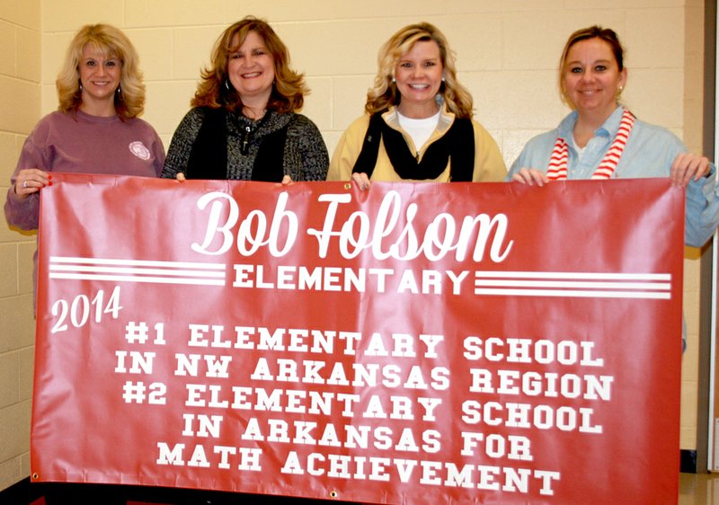 PHOTO COURTESY Farmington Board of Education recently presented Folsom Elementary with a banner to recognize it for being first in the region and second in the state for its third-grade math scores on the 2014 Benchmark tests. Folsom, for the second consecutive year, also was named a 2014 high performing school and ranks in the top 10 percent of schools in the state, based on academic achievement and academic growth. Holding the banner are third-grade teachers Liz Law, left, Jennifer Hopper, Lisa Ensign and Monica VanZant.