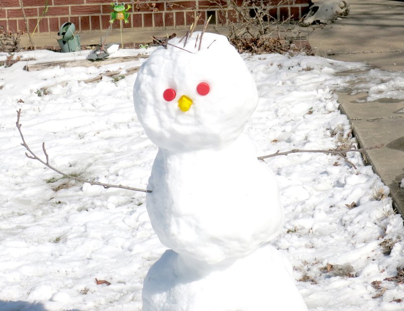 Enjoying the Day This snowman (right), spotted on El Paso Street, S.E., in Gravette recently, seemed to be enjoying the chilly weather. Unlike most folks in the area who were complaining about the weather, he was probably not yearning for warmer days, knowing that, when they arrived, he would not be around to see them. Photo by Susan Holland
