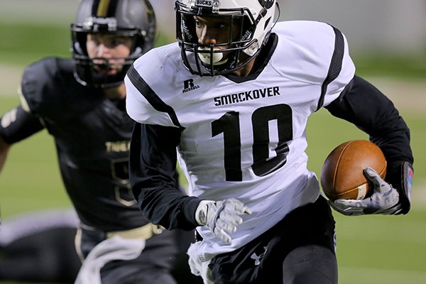 Smackover's Jordan Jones runs in a pass for their second TD in the first quarter during their 3A state championship football game Friday, Dec. 12, 2014, at War Memorial Stadium in Little Rock. 