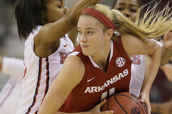 Mississippi's Shandricka Sessom, left, defends against Arkansas' Calli Berna (11) in the first half of a Southeastern Conference tournament women's NCAA college basketball game in North Little Rock, Ark., Thursday, March 5, 2015. (AP Photo/Danny Johnston)