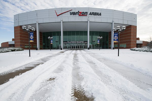 Snow and ice cover the entrance to Verizon Arena in Little Rock, Ark., Thursday, March, 5, 2015, during second day of the Southeastern Conference women's basketball tournament. Forecasters said an overnight storm dropped up to 6 inches of sleet and snow across central Arkansas and more than 8 inches in the northeast part of the state. (AP Photo/Knoxville News Sentinel, Adam Lau)