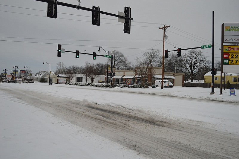 Snow and slush covers JFK Boulevard in North Little Rock's Park Hill neighborhood Thursday, March 5, 2015.