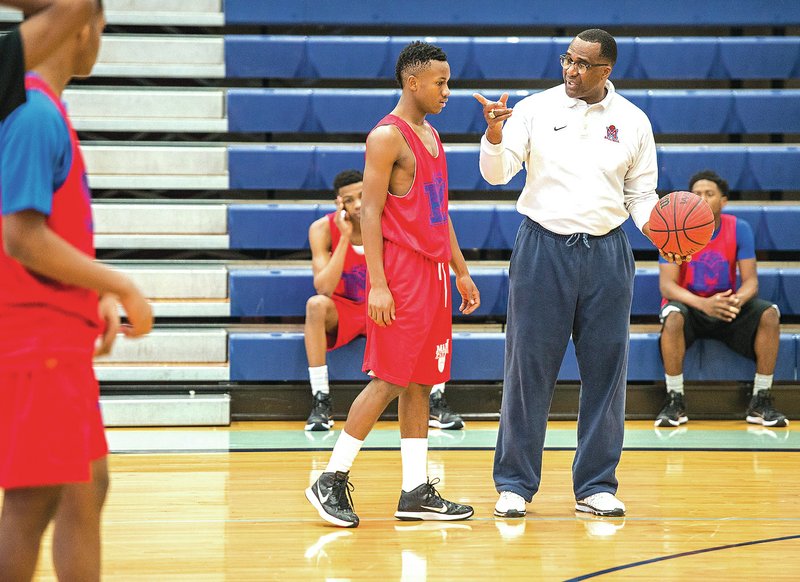 Irving Clay, Marion head boys basketball coach, leads his team in practice Thursday at Har-Ber High School in Springdale. The team will play in the 6A state basketball tournament in Siloam Springs, but it’s been delayed twice for bad weather.