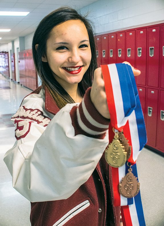Destiny Nunez, a Beebe High School junior, became the first female wrestling state champion in Arkansas when she won the 106-pound-weight-class title at the Class 5A state meet in February. Nunez is shown with the various medals she has won in wrestling competitions.
