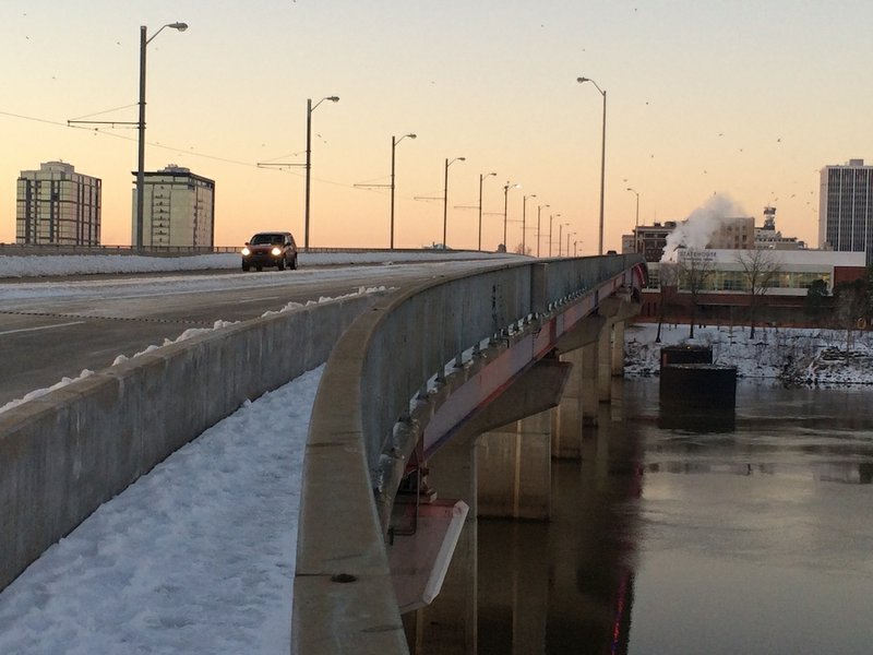 Sparse traffic travels the Main Street Bridge slowly over the Arkansas River between North Little Rock and Little Rock on Friday morning, March 6, 2015. 

