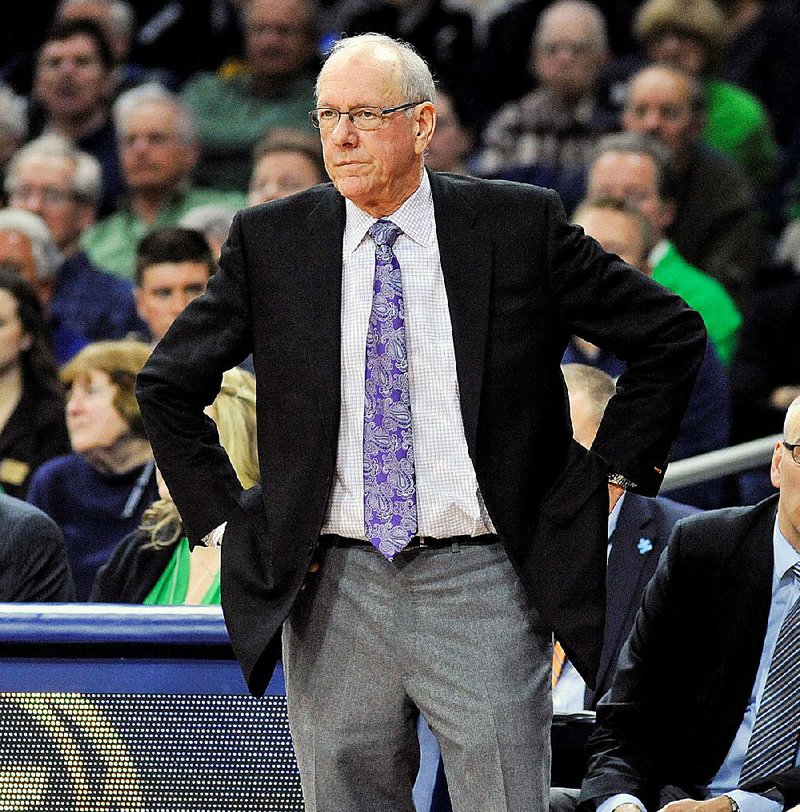 FILE - In this Feb. 24, 2015, file photo, Syracuse coach Jim Boeheim watches his team in the first half of an NCAA college basketball game against Notre Dame in South Bend, Ind. The NCAA has suspended Syracuse coach Jim Boeheim Friday, March 6, 2015, for nine games for academic, drug and gifts violations committed primarily by the men's basketball program. (AP Photo/Joe Raymond, File)