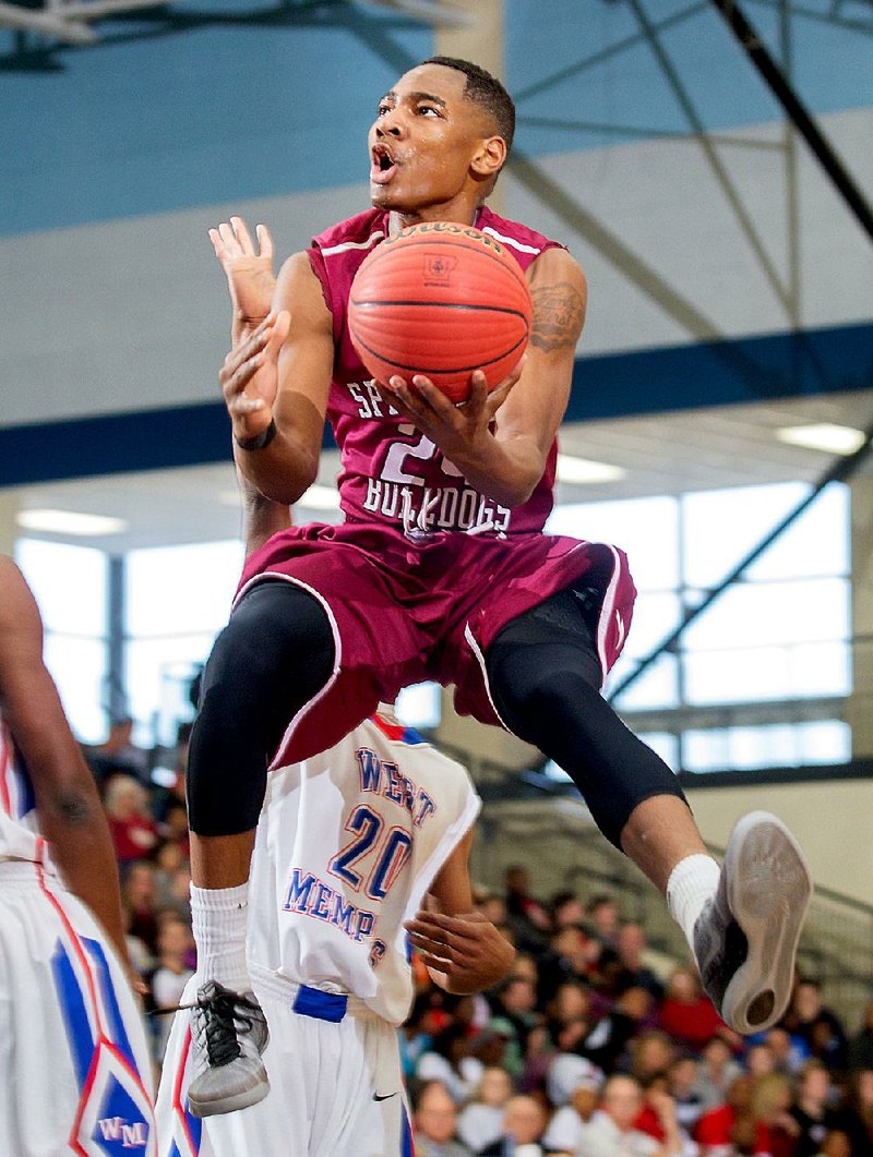 NWA Democrat-Gazette/JASON IVESTER --03/06/2015--
Chris Owens, Springdale senior, manuevers to the basket against West Memphis on Friday, March 6, 2015, during the 7A State Tournament at Springdale Har-Ber High School. See more photos at nwadg.com/photos.