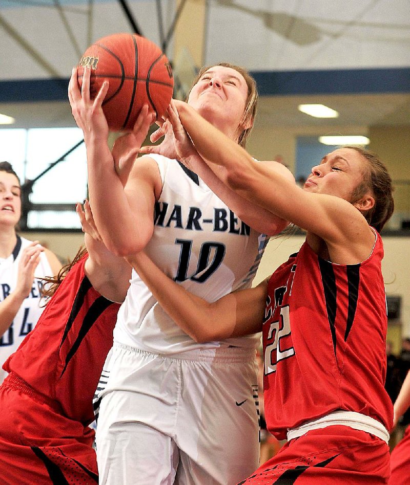 NWA Democrat-Gazette/Michael Woods --03/06/2015--w@NWAMICHAELW... Springdale Har-Ber's Bailey Schalk (10) is fouled by Cabot defender Alyssa Hamilton (22) as she drives to the hoop during Friday's game in the 7A Arkansas State Basketball Tournament at Har-Ber High School in Springdale.