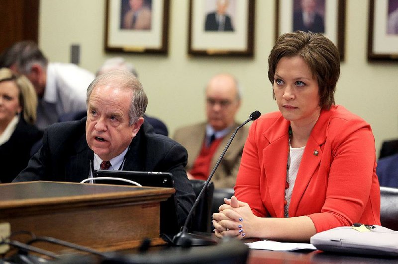 Arkansas Democrat-Gazette/RICK MCFARLAND --03/06/15--  Bill Bryant, director Arkansas State Police, answers a question during a meeting of the House Committee on State Agencies and Governmental Affairs at the Capitol in Little Rock Friday. Rep. Della Rosa, R-Lowell, (right) sponsored the bill which is to safeguard funds of State Police facilities and equipement. The bill was givne a due pass.