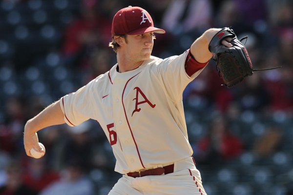 Dominic Taccolini of Arkansas delivers a pitch against Loyola Marymount during the first inning Saturday, March 7, 2015, at Baum Stadium in Fayetteville.