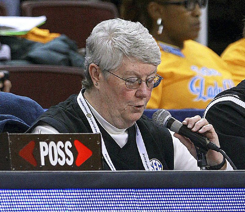 Arkansas Democrat-Gazette/STATON BREIDENTHAL --3/6/15-- Announcer Susan Nunnelly works Friday during the Arkansas game at the SEC Women's tournament in North Little Rock.  