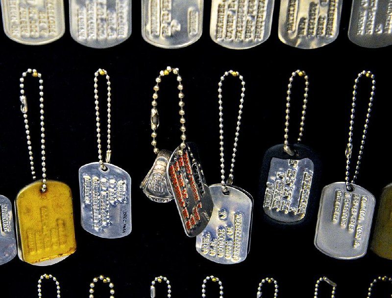 Fifty years after the start of the war, the Vietnam Veterans Memorial Fund is raising money for an education center that will display some of the mementos left at the Wall.  This is an array of dog tags left at the Wall. Illustrates VIETNAM (category a), by Michael E. Ruane (c) 2015, The Washington Post. Moved Tuesday, March 3, 2015 (MUST CREDIT: Washington Post photo by Michael S. Williamson) 

