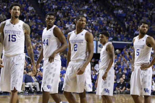 Kentucky players, from left, Willie Cauley-Stein, Dakari Johnson, Aaron Harrison, Tyler Ulis and Andrew Harrison re-enter the game during the second half of an NCAA college basketball game against Florida, Saturday, March 7, 2015, in Lexington, Ky. Kentucky won 67-50. (AP Photo/James Crisp)