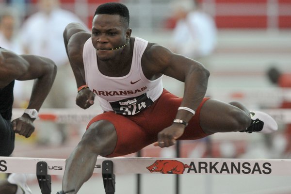 Arkansas hurdler Omar McLeod clears a hurdle during the men's 60-meter hurdle finals at the Razorback Invitational track meet at the Randal Tyson Track Complex on Jan. 31, 2015, in Fayetteville.