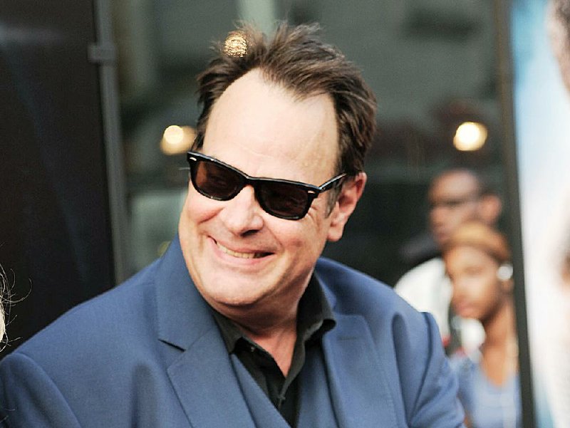 FILE - In this July 21, 2014 file photo, Dan Aykroyd attends the world premiere of "Get On Up" in New York. Aykroyd plans to make a donation to the family of a Philadelphia police officer killed in the line of duty. KYW-TV reports the actor made the announcement while visiting the Philadelphia Flower Show to promote his vodka company on Friday, March 6, 2015. (Photo by Evan Agostini/Invision/AP, File)