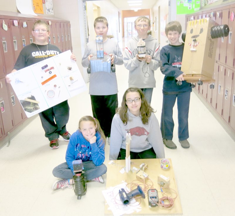 Photo by Susan Holland A few fifth-grade students brought their simple machines science projects into the hall to display them. Pictured are Meghan Woodmancy (front, left), Malie Johnson, Logan Ellis (back, left), Wilson LaPorte, Terry York and Mark Carnahan.