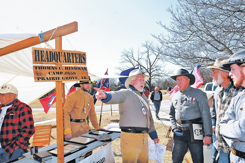 NWA Democrat-Gazette/FLIP PUTTHOFF Damon Hudson of Pea Ridge (center) talks Saturday about the Battle of Pea Ridge at Pea Ridge National Military Park during an event marking the anniversary of the Civil War battle. Artillery firing demonstrations, re-enactors in period clothing and memorials to the soldiers were part of the observance.