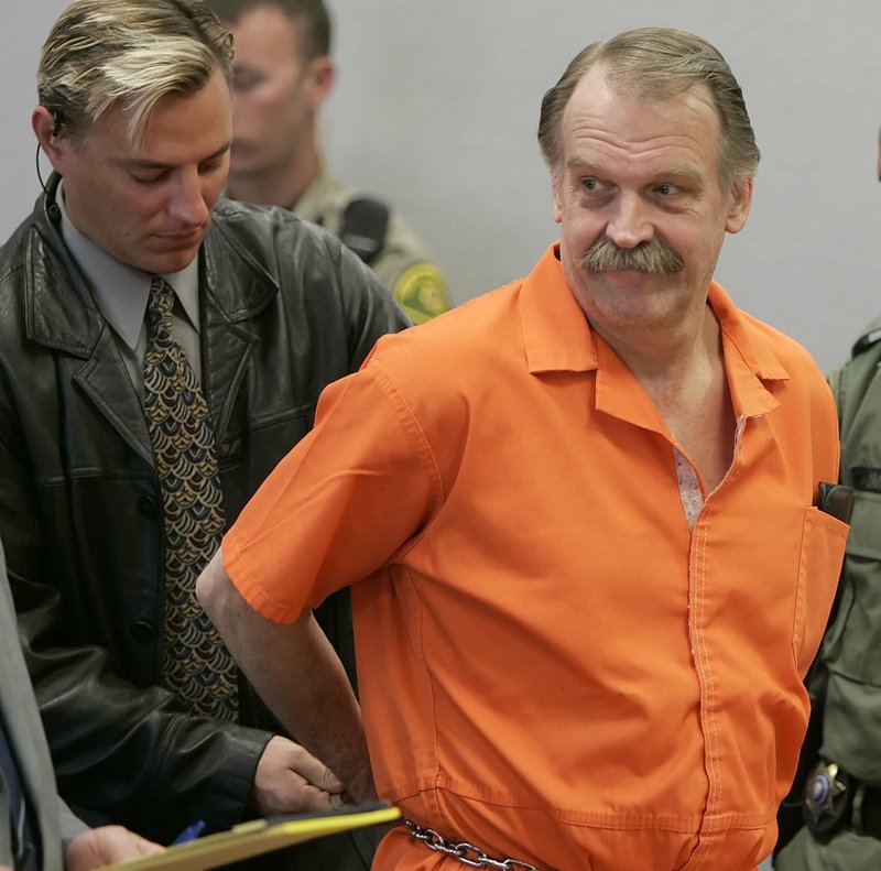 Looking ahead: In this Oct. 6, 2005 file photo, convicted murderer and Death Row inmate Ron Lafferty is handcuffed after his court hearing in a courtroom in Provo, Utah. Utah, the only state in the past 40 years to carry out a death sentence by firing squad, is poised to bring back the Old West-style executions if the state cannot track down drugs used in lethal injections.