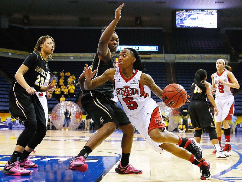 Arkansas State guard Brittney Gill (5) drives past Appalachian State’s Mia Marshall during Wednesday’s game at the Sun Belt Conference Tournament at Lakefront Arena in New Orleans. 