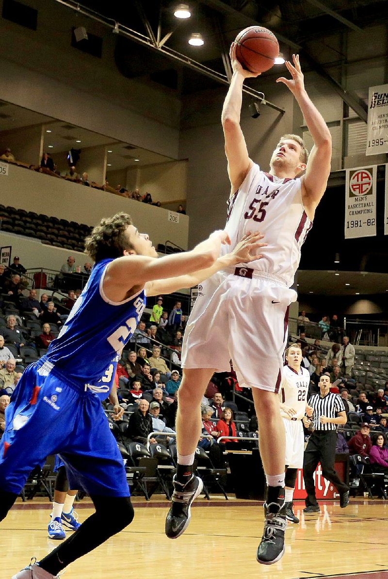 Gus Leeper (right) is the only player left from UALR’s Sun Belt Conference championship team in 2011. The Trojans face South Alabama in the Sun Belt Tournament today in New Orleans. 