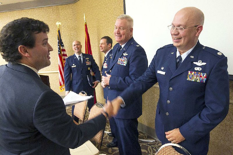 Chad Causey (left), executive director of Arkansas Aerospace and Defense Alliance, greets Lt. Col. Neil Hede (right) and other commanders from Little Rock Air Force Base during the Arkansas Aerospace Summit on Wednesday at the Crowne Plaza hotel in Little Rock. The other commanders (from left) are Col. Johnnie Martinez, Col. Jim Dryjanski and Col. Robert Ator II.