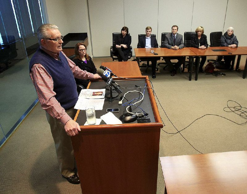 Flanked by relatives and friends Thursday, Roger Glasgow speaks at a Little Rock news conference about the discovery of remains identified as those of his brother John Glasgow, whose car was found at Petit Jean State Park near Morrilton more than seven years ago. John Glasgow’s widow, Melinda, is seated second from left. 