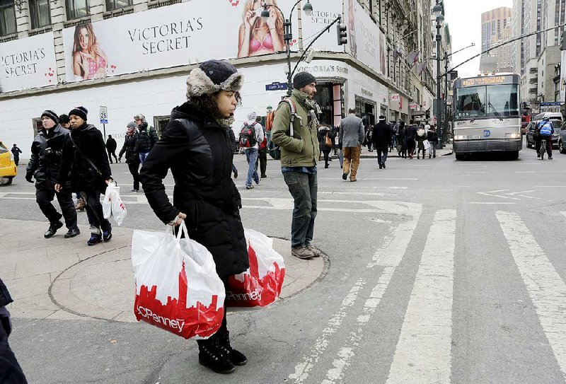 Shoppers like this one in New York City last month were not numerous enough to shore up retail sales in February, the Commerce Department said. 