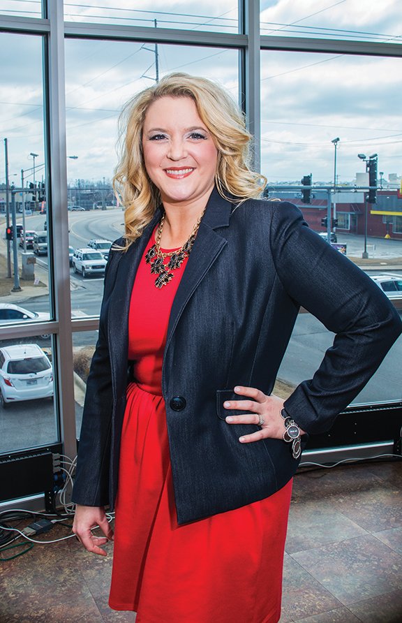 Emily Boyd is shown in her office on the second floor of the Kernodle and Katon Asset Management Group’s building at the corner of Main Street and Beebe Capps Expressway in Searcy. Boyd is marketing director for the company and serves as president of the Searcy Junior Auxiliary, a women’s group that emphasizes service within local communities, especially service pertaining to children.