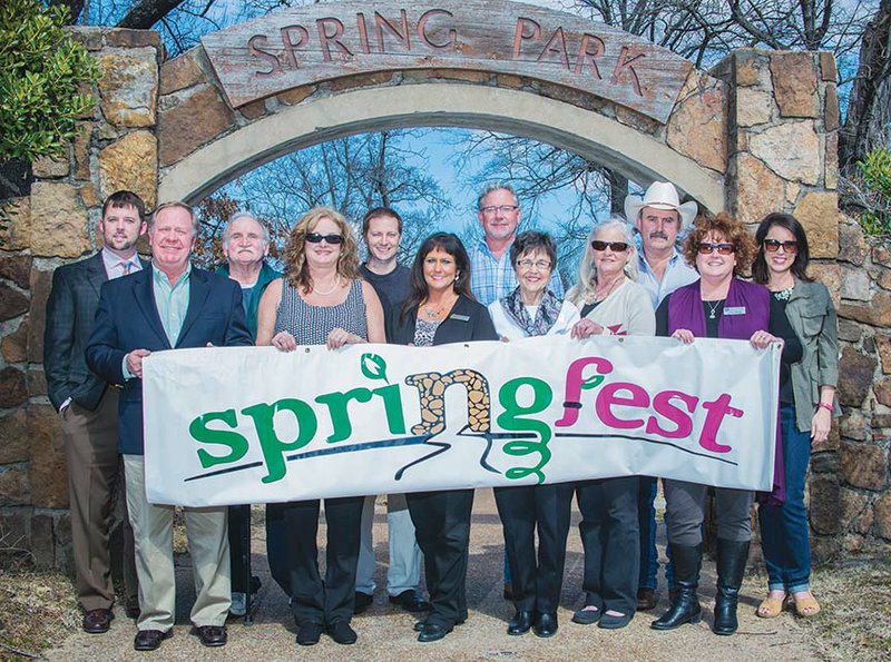 Shown with the banner for Springfest, which will be held April 24 and 25 in Spring Park in Heber Springs, are Brett Graham, from left, treasurer of the Heber Springs Area Chamber of Commerce; Mayor Jimmy Clark; Fred Glascock, director of public works for the city; Theresa Bobo, event coordinator for the chamber; Clint Bell; Rena Kelley; Will Humphries; Ina Brown, manager of special projects for the chamber; Debbie Thompson; Cleburne County Judge Jerry Holmes; Julie Murray, executive director of the chamber; and Cheryl Shook.