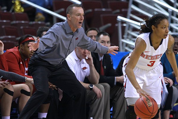 Arkansas coach Jimmy Dykes motions from the sideline during a game against Ole Miss on Thursday, March 5, 2015, during the SEC Tournament at Verizon Arena in North Little Rock. 