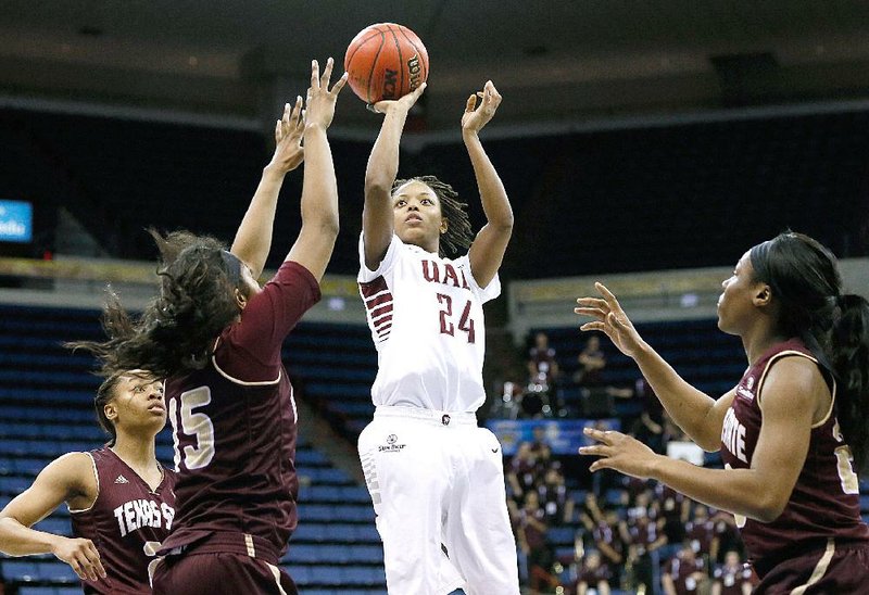 UALR guard Taylor Gault (24) scored 18 points in the Trojans’ 87-44 victory over Texas State in the semifinals of the Sun Belt Tournament on Friday in New Orleans. 