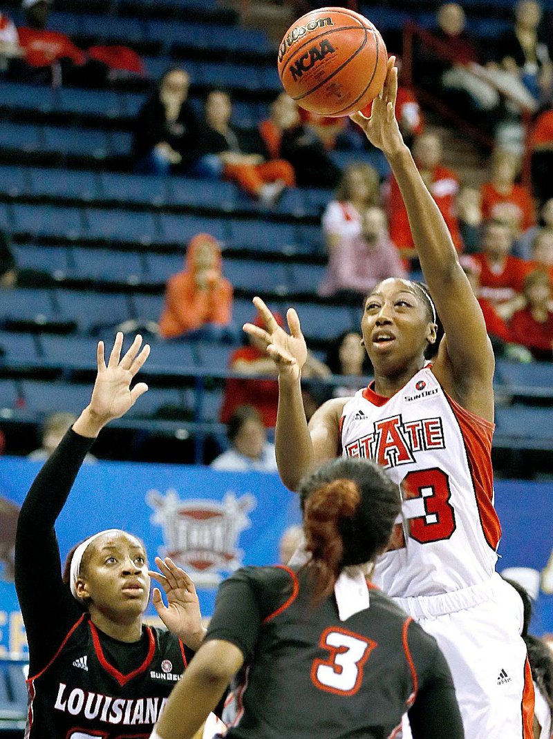 Arkansas State forward Jasmine Hunt (right) shoots over Louisiana-Lafayette guard Robbie Brown (3) and forward Simone Fields during the second half of Friday’s victory.