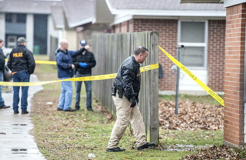 Springdale police investigate a shooting Friday at Applegate Apartments in Springdale that left 18-year-old Fabian Rodriguez dead.