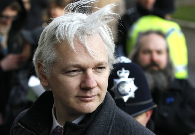 In this Feb. 1, 2012 file photo, Julian Assange, WikiLeaks founder, arrives at the Supreme Court in London. Swedish prosecutors on Friday March 13, 2015 offered to question WikiLeaks founder Julian Assange in London, potentially unlocking a stalemate in an almost five-year-old investigation into alleged sex crimes. Prosecutors had previously refused to travel to London, where Assange has taken refuge at the Ecuadorean embassy.