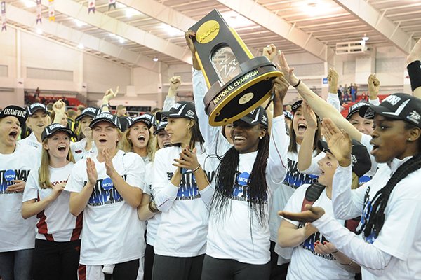 Arkansas athletes celebrate Saturday, March 14, 2015, after the Arkansas women's team won the NCAA Indoor Track and Field Championship at the Randal Tyson Track Center in Fayetteville.